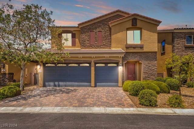 view of front of property with a garage