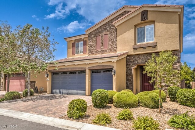 view of front of home with a garage