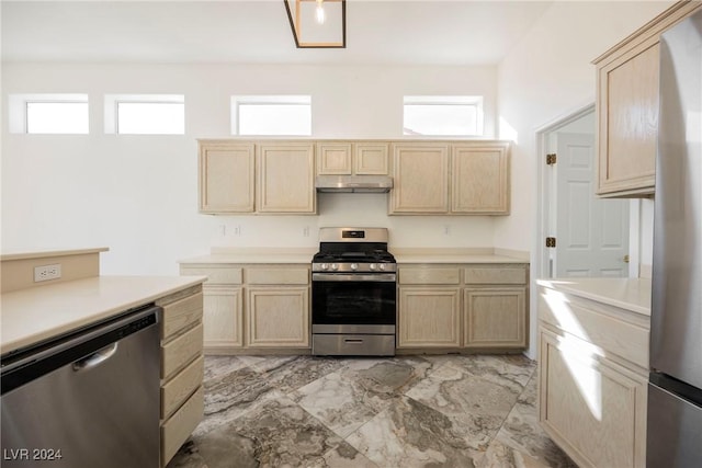 kitchen featuring light brown cabinetry and stainless steel appliances