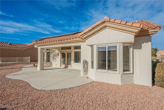 rear view of property featuring a patio area