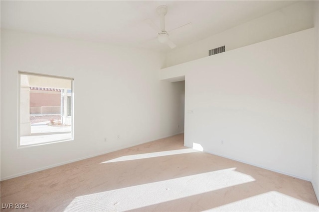 spare room featuring carpet flooring and ceiling fan