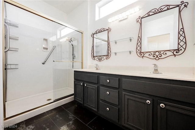 bathroom featuring vanity and an enclosed shower