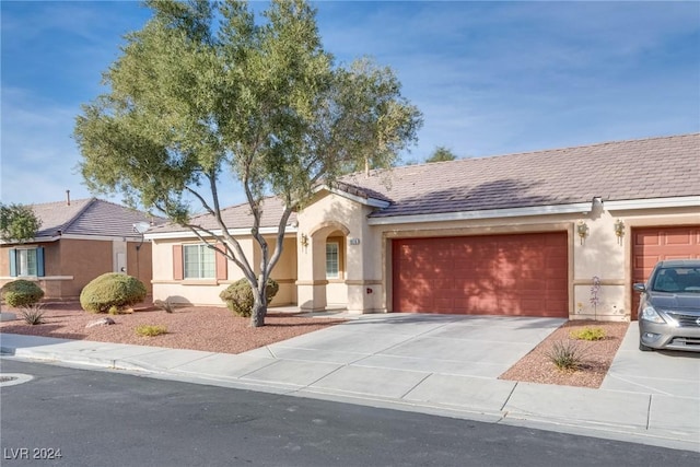 ranch-style home featuring a garage