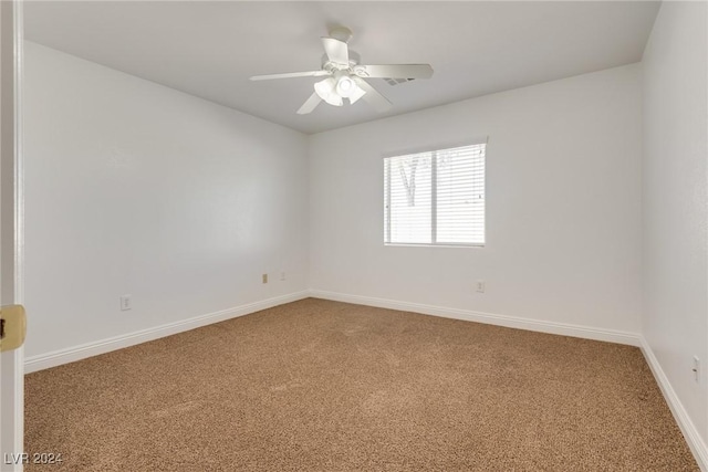 spare room with carpet and ceiling fan