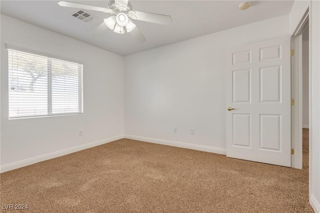 unfurnished room featuring carpet flooring and ceiling fan