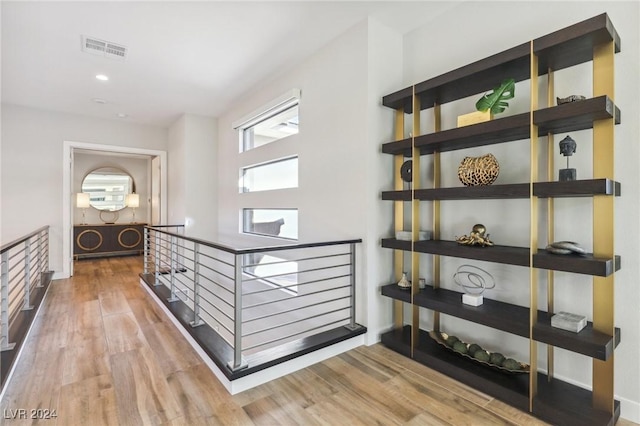 corridor featuring hardwood / wood-style floors