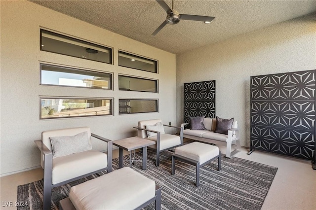 view of patio with outdoor lounge area and ceiling fan