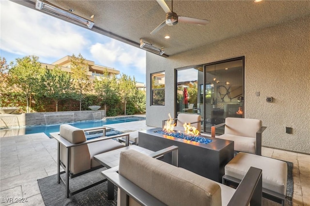 view of patio with pool water feature, an outdoor living space with a fire pit, and ceiling fan