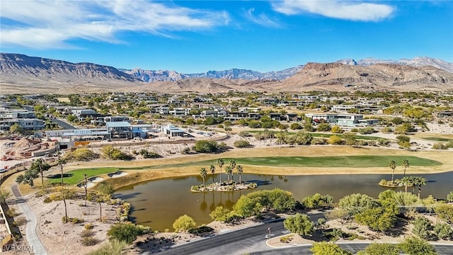 drone / aerial view with a water and mountain view