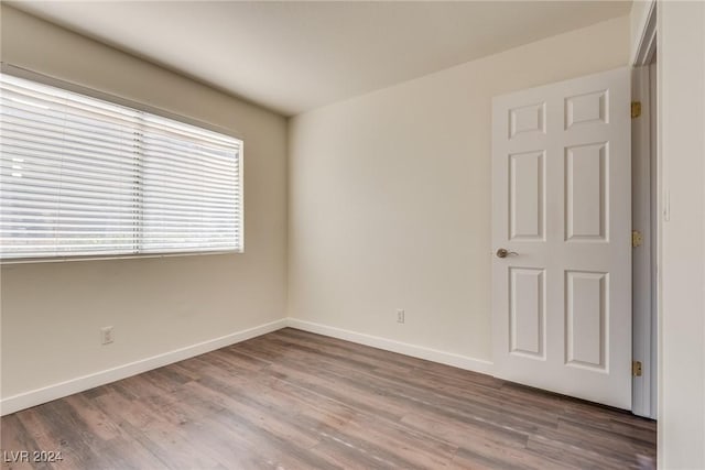 unfurnished room featuring hardwood / wood-style floors