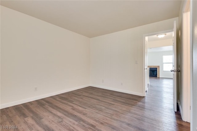 empty room with dark hardwood / wood-style floors