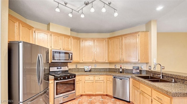 kitchen with sink, light brown cabinets, and appliances with stainless steel finishes