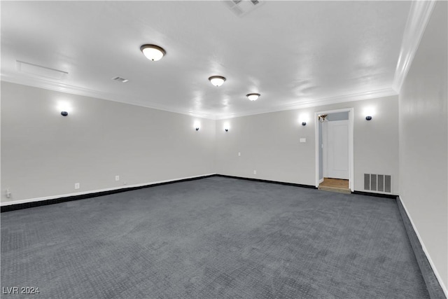 carpeted spare room featuring ornamental molding