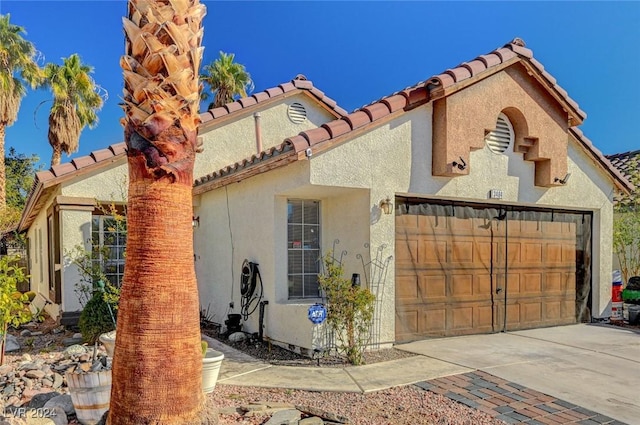 exterior space with a garage