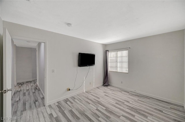 unfurnished room featuring light wood-type flooring