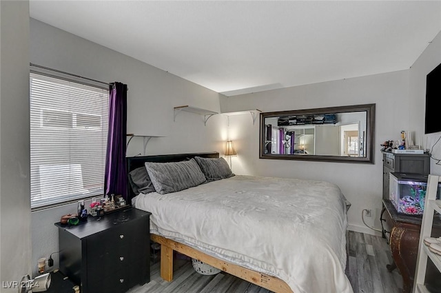 bedroom featuring wood-type flooring