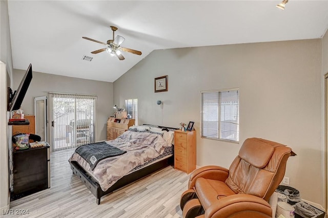 bedroom featuring light wood-type flooring, access to outside, vaulted ceiling, and ceiling fan