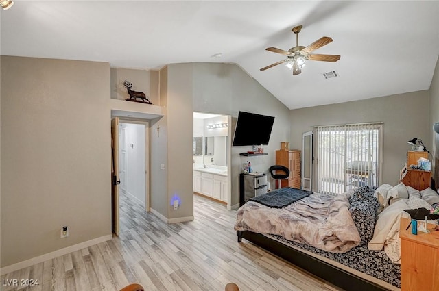 bedroom with ceiling fan, light hardwood / wood-style floors, lofted ceiling, and ensuite bathroom