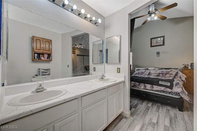 bathroom featuring ceiling fan, vanity, and hardwood / wood-style flooring