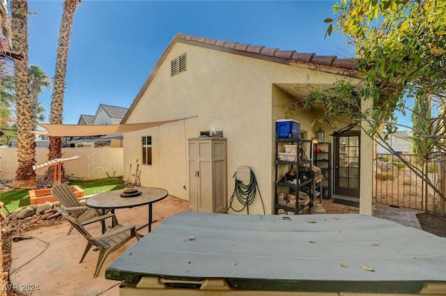 rear view of property with a patio