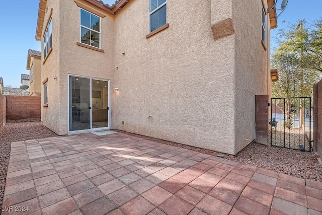 back of house featuring a patio area