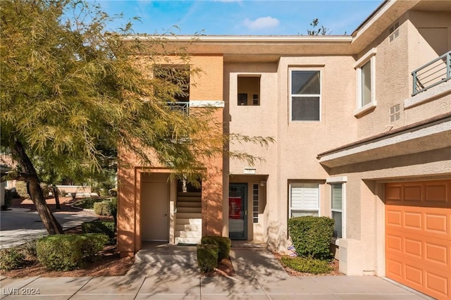 townhome / multi-family property featuring a garage