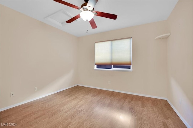 empty room featuring ceiling fan and light wood-type flooring