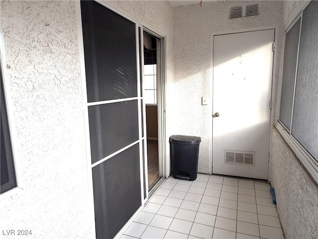 interior space with light tile patterned floors