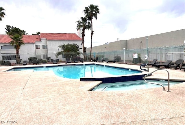 view of swimming pool with a patio area