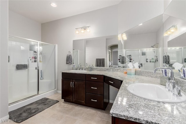 bathroom featuring vanity and walk in shower