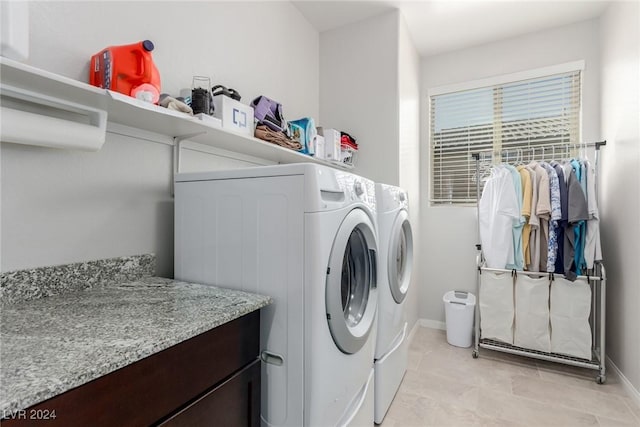 clothes washing area featuring washer and dryer