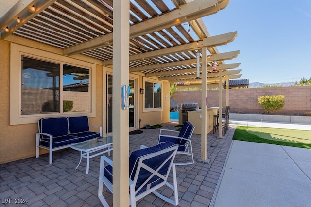 view of patio featuring outdoor lounge area, a grill, a pergola, and an outdoor bar