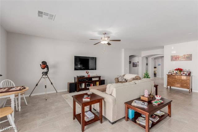 living room featuring ceiling fan and light tile patterned floors