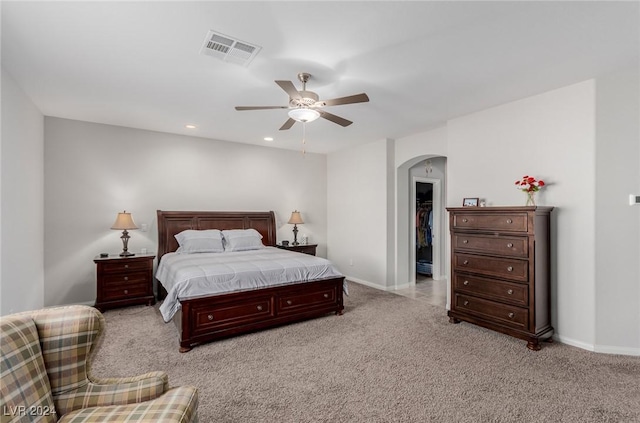 bedroom featuring ceiling fan and light carpet