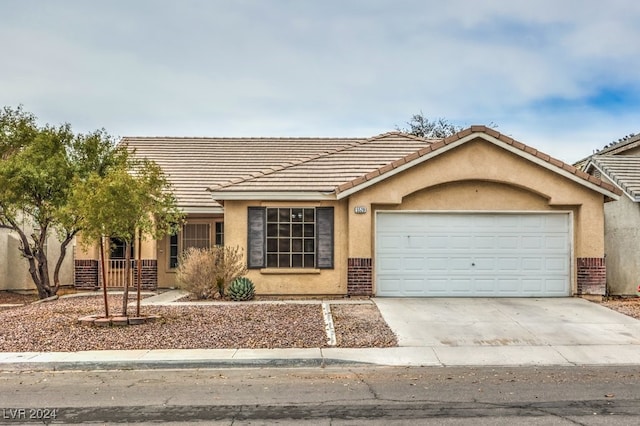 ranch-style home featuring a garage