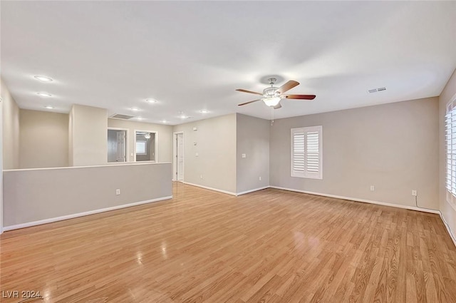 unfurnished room with light hardwood / wood-style floors and ceiling fan