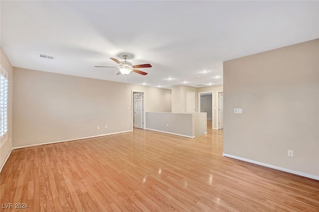 spare room featuring ceiling fan and light hardwood / wood-style flooring