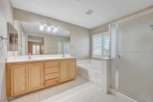 bathroom featuring separate shower and tub, tile patterned flooring, and vanity