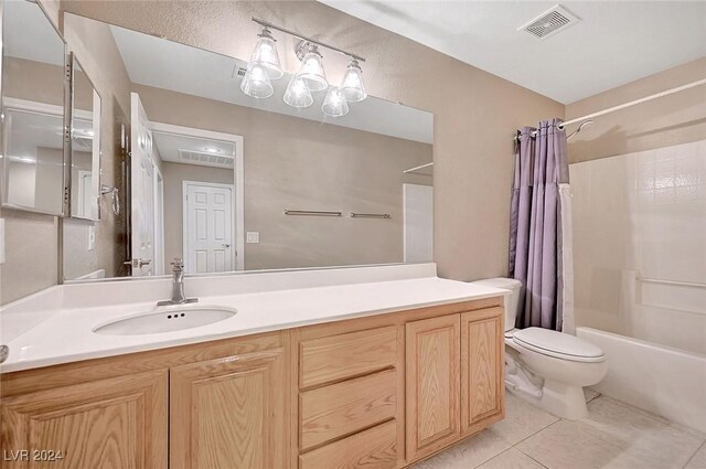 full bathroom with tile patterned flooring, vanity, toilet, and shower / tub combo with curtain