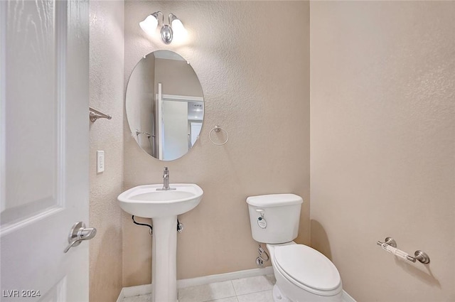 bathroom featuring tile patterned floors, sink, and toilet