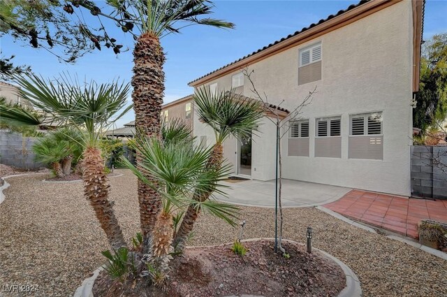 back of house with a patio area