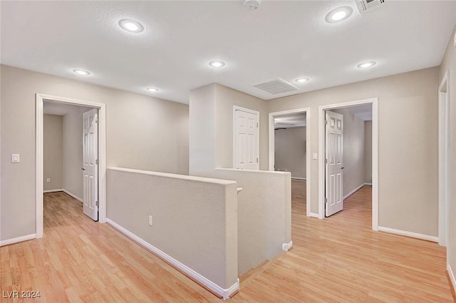 hallway featuring light wood-type flooring