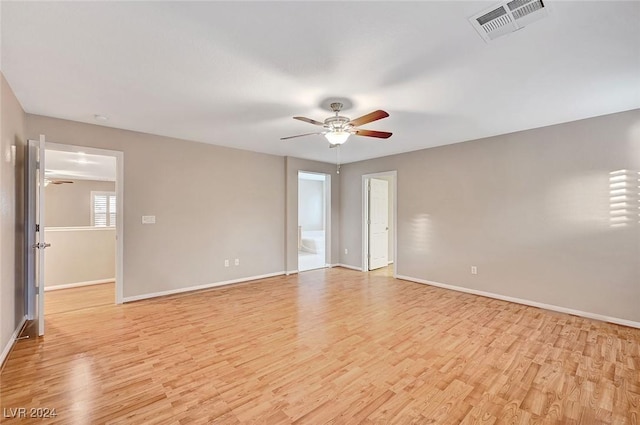 unfurnished room featuring ceiling fan and light hardwood / wood-style flooring