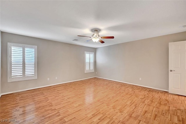 unfurnished room featuring ceiling fan and light wood-type flooring