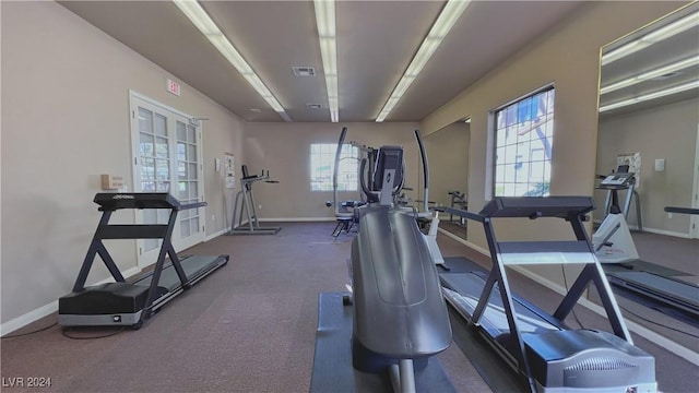exercise room with baseboards