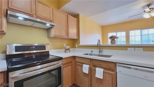 kitchen featuring stainless steel electric range oven, dishwasher, under cabinet range hood, a sink, and light countertops