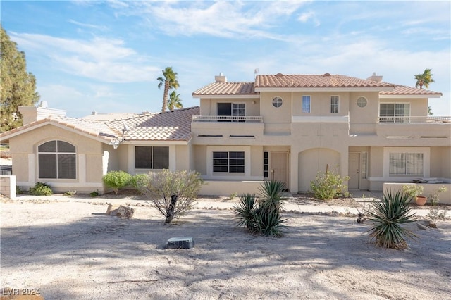 2157 Camel Mesa Dr, Laughlin, NV 89029 - mediterranean / spanish-style home featuring stucco siding, a balcony, and a tiled roof