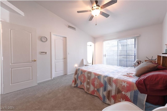 carpeted bedroom featuring ceiling fan and lofted ceiling