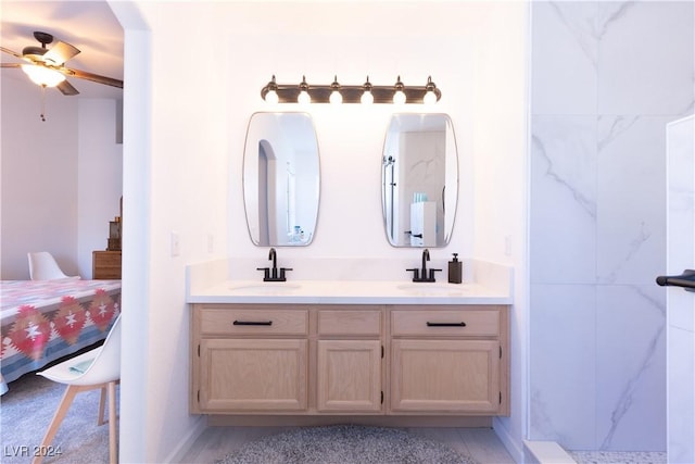 bathroom with ceiling fan and vanity