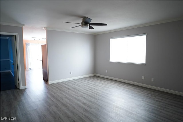 empty room with wood-type flooring, crown molding, and ceiling fan